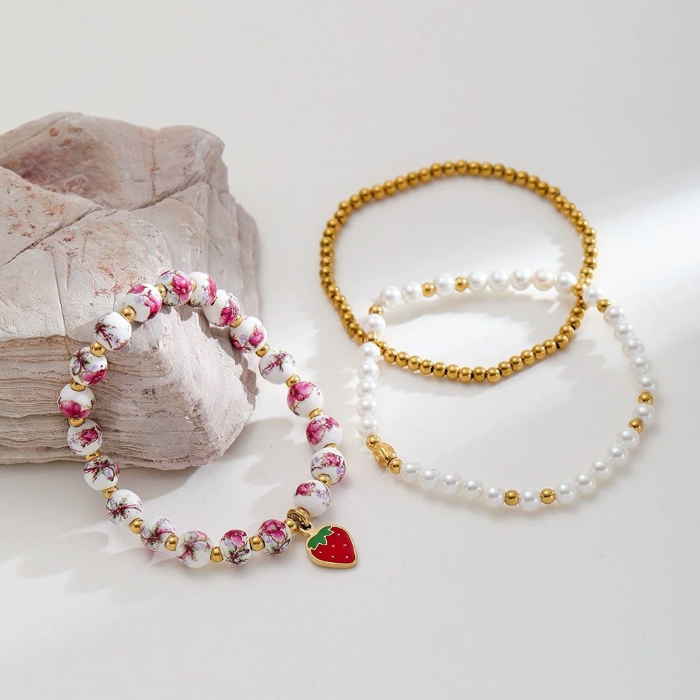 Mystiquè Gold-Plated Floral Beaded Bracelet with Pearl & Strawberry Charm