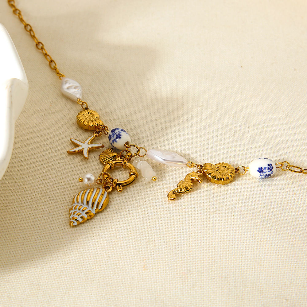 Mystiquè Oceanic Charm Necklace | Gold-Plated Pearl & Shell Pendant