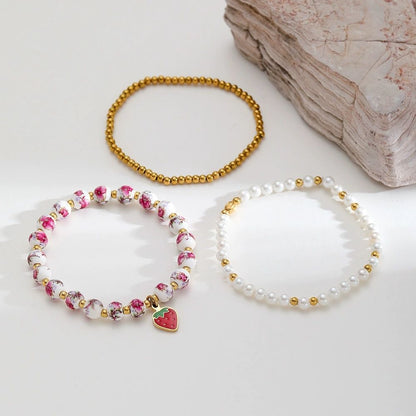 Mystiquè Gold-Plated Floral Beaded Bracelet with Pearl & Strawberry Charm