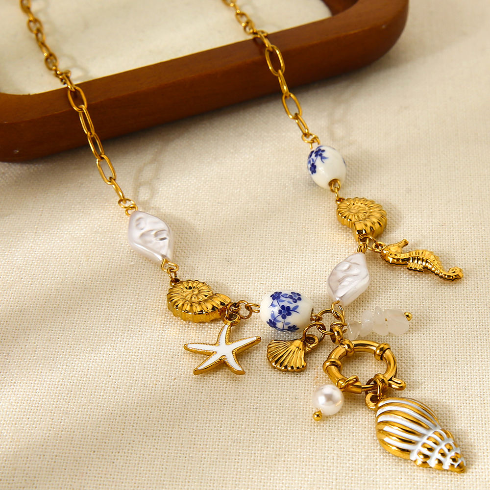 Mystiquè Oceanic Charm Necklace | Gold-Plated Pearl & Shell Pendant