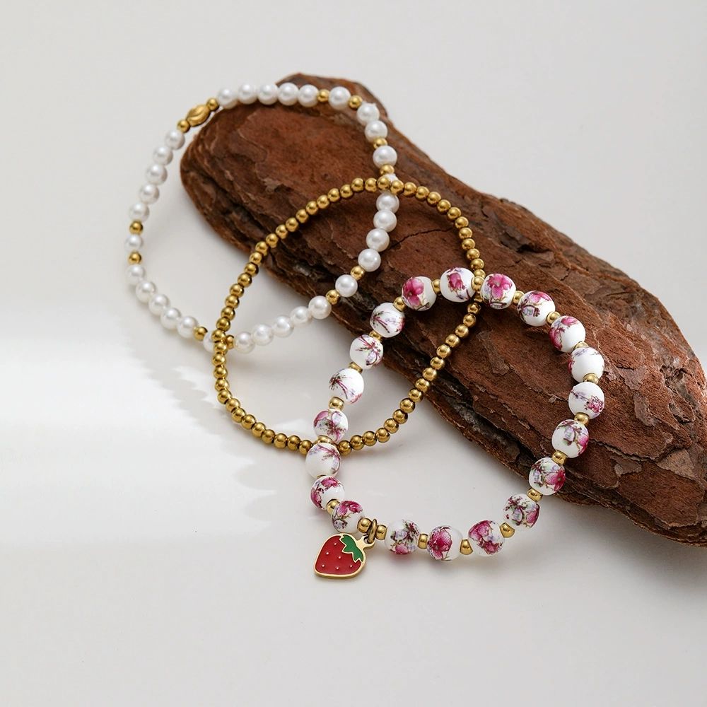 Mystiquè Gold-Plated Floral Beaded Bracelet with Pearl & Strawberry Charm