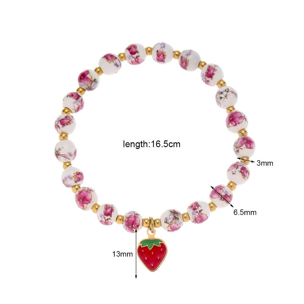 Mystiquè Gold-Plated Floral Beaded Bracelet with Pearl & Strawberry Charm